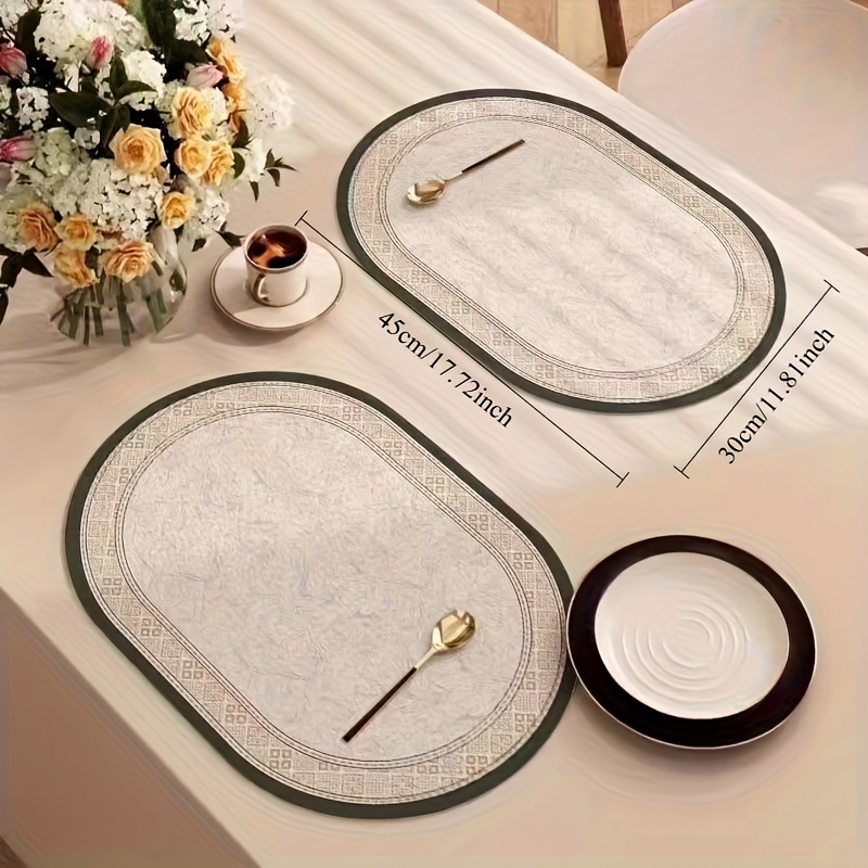 4-piece set of non-slip faux leather placemats, heat-insulating and easy to clean.