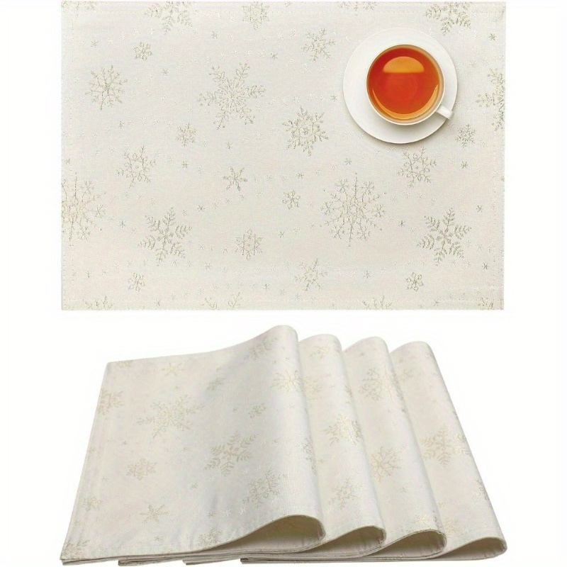 4-piece white placemats with gold snowflake pattern