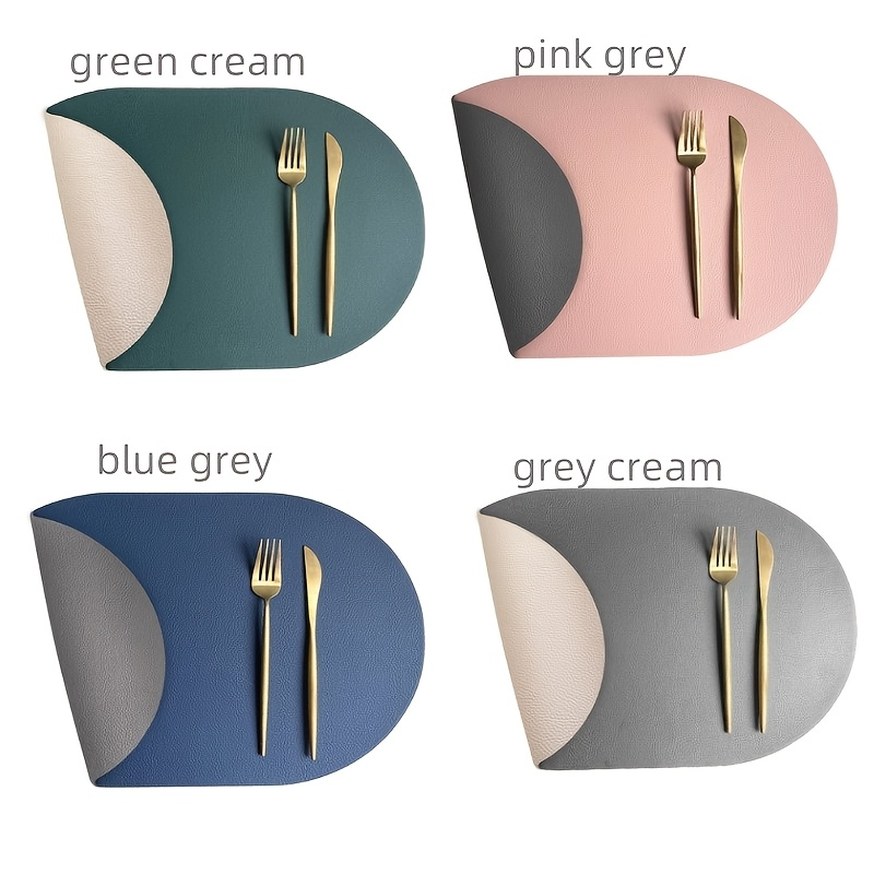 Four-piece set of oval faux leather placemats, reversible, heat resistant.